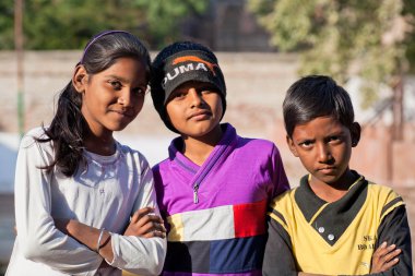 Children hug on the street