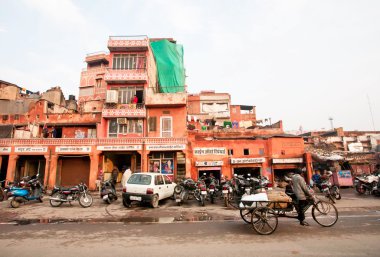 Cycle rickshaw drive through the busy asian street