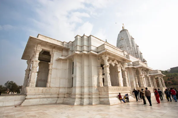 People walk around white marble Birla Temple in India — Stok fotoğraf