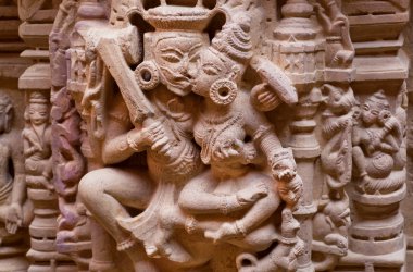 Hindu gods kissing with tongues on bas-relief of 12th century