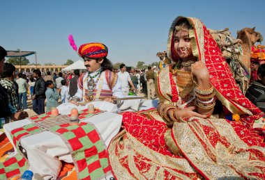 Children in beautiful indian costumes going to carnival