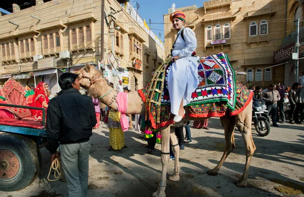 Young man in indian dress rides the camel — Stock Photo, Image
