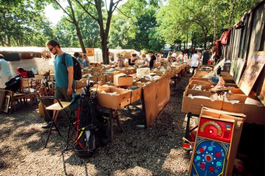 People choose the dishes on the flea market
