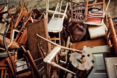 Wooden chairs and vintage chairs, thrown into the street