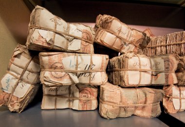 Selective focus on bundles of retro banknotes in bank