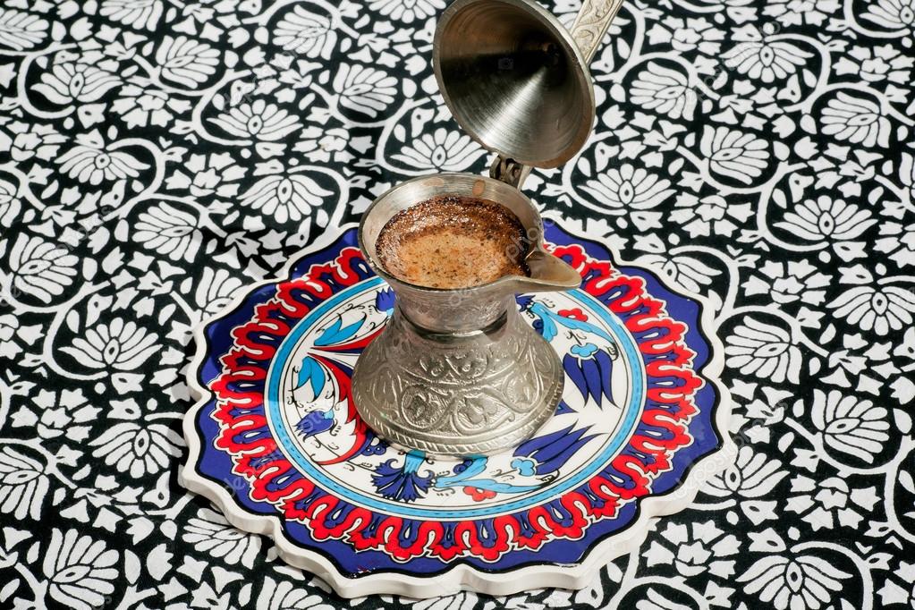 Morning coffee on the tablecloth with asian ornaments