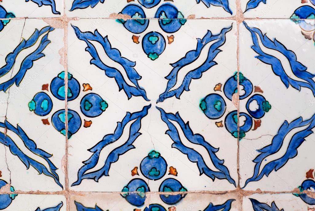 Blue leaves and berries in a pattern of ceramic tiles, made in 16th century