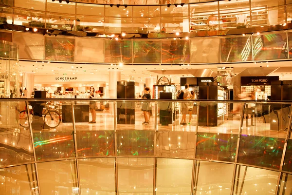 Customers buying clothes in shopping mall Galerie Lafayette Ліцензійні Стокові Фото