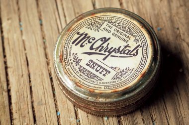 Vintage can of smokeless tobacco product, McChrystals snuff, made in England clipart