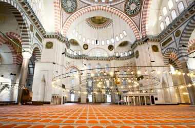 Interior of 16th century Suleymaniye Mosque with architectural wonders and bright lights 