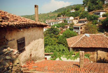 Village landscape with tiled roofs of old rustic houses