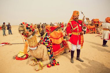 Saxophone player in uniform of orchestra member ready to play on the Desert Festival