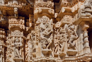 Hindu gods on the carved stone wall of historical Chitaurgarh fortress in India. UNESCO World Heritage Site