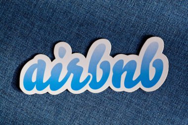 AirBnb hospitality service logo on blue background
