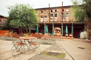 Empty cafe in abandoned courtyard of artistic area of Berlin