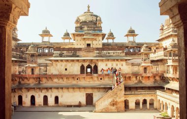 People climbing the stairs of the ancient fort Jahangir Mahal in Madhya Pradesh state