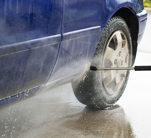 Car wash using high pressure water jet.