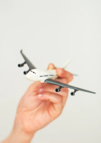Child hand holding model airplane. Place for text. — Stock Photo, Image