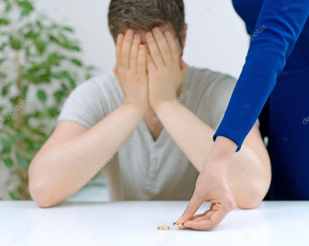 Divorce concept. Woman returning wedding ring to her husband. ⬇ Stock