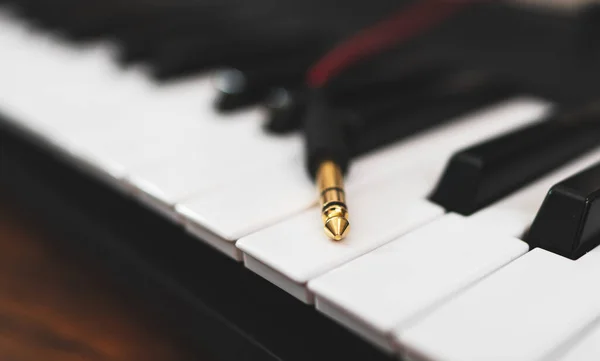 Headphone jack on the musical keyboard.