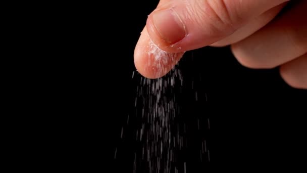 Man Lägga Salt Till Skålen Svart Bakgrund Slow Motion — Stockvideo