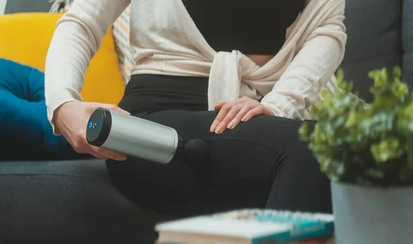 Woman Massaging Leg Massage Percussion Device Home — Stock Photo, Image