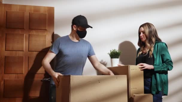 Masked Postman Picks Cardboard Boxes Apartment — Stock Video
