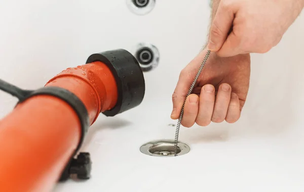 Plumber Using Drain Snake Unclog Bathtub — Stock Photo, Image