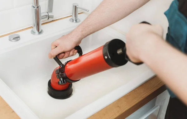 Plumber Unclogging Kitchen Sink Professional Force Pump Cleaner — Stock Photo, Image