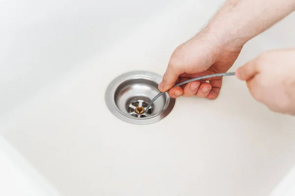 Plumber Using Drain Snake Unclog Kitchen Sink — Stock Photo, Image