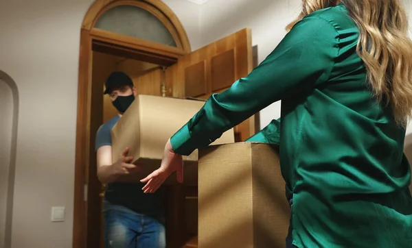 Masked Postman Cap Delivers Cardboard Boxes — Stock Photo, Image