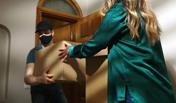 Masked Postman Cap Delivers Cardboard Boxes — Stock Photo, Image