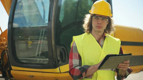 Excavator Operator Hard Hat Using Tablet — 스톡 사진