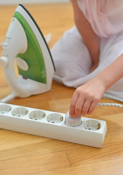 Dangerous situation at home. Child playing with electricity. — Stock Photo, Image