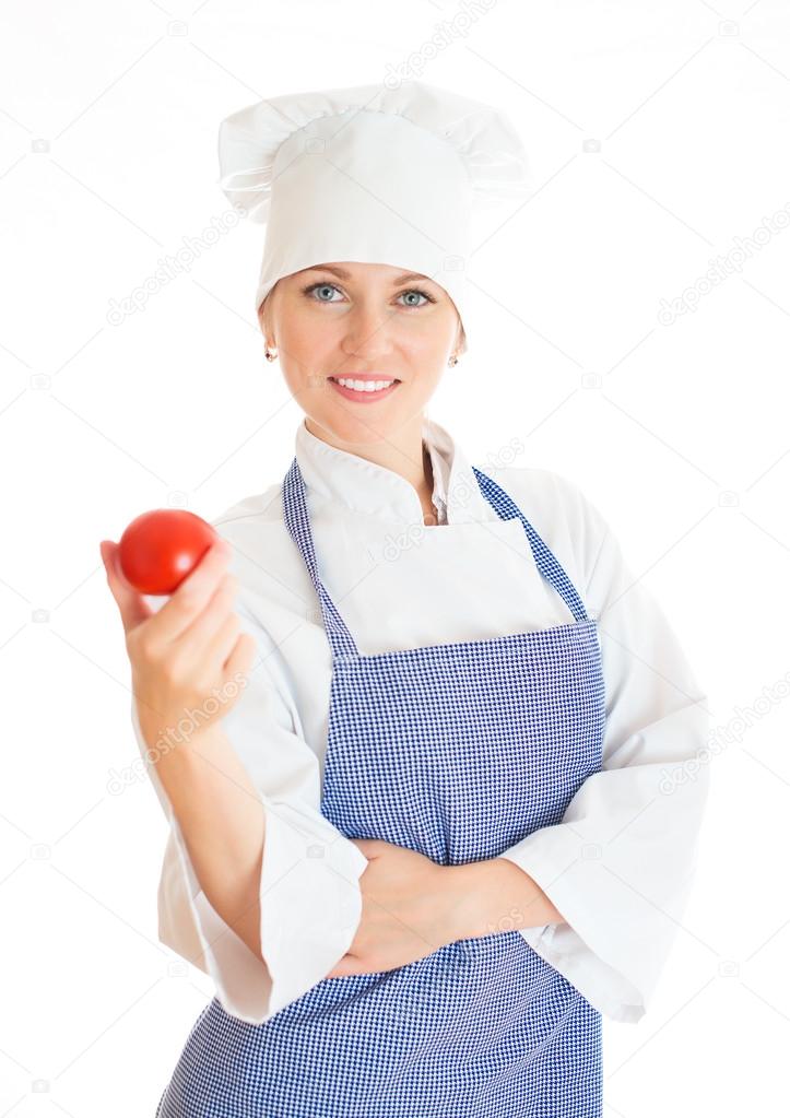 Portrait of happy female chef cook with tomato. Isolated on white.
