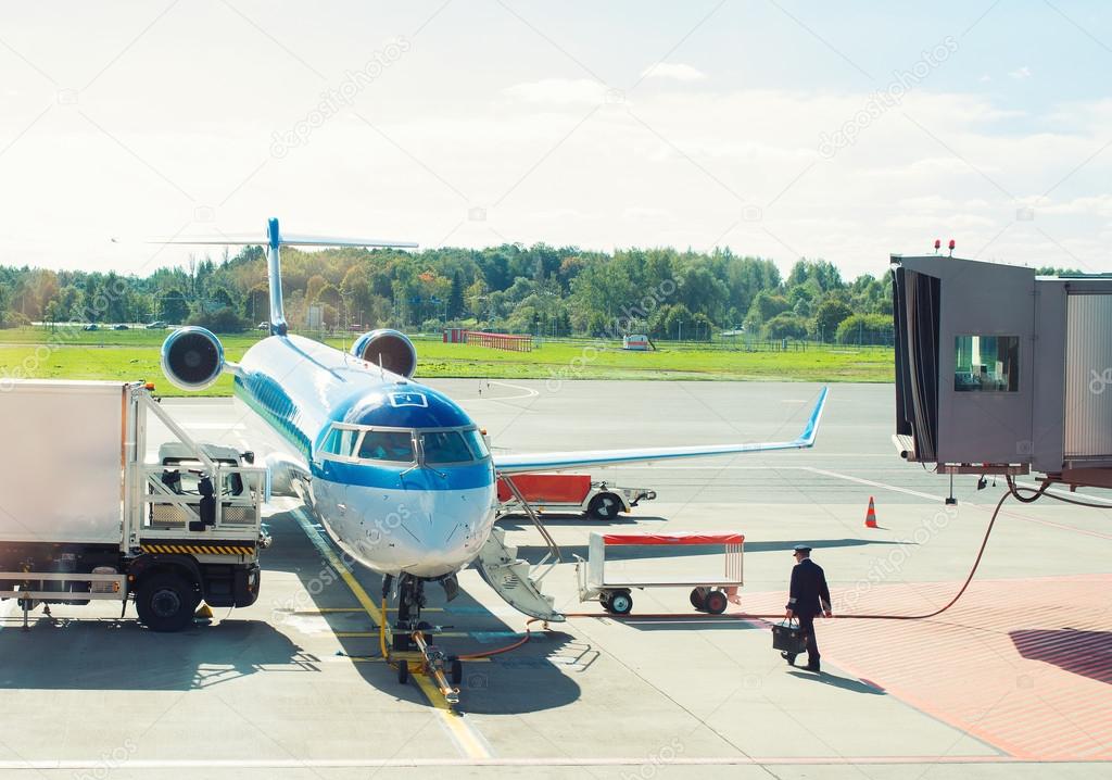 Passenger plane maintenance in airport before flight.