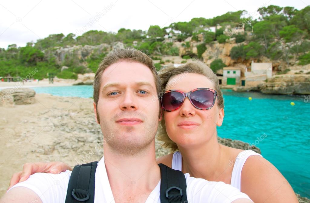 Selfie. Couple taking picture on the beach.