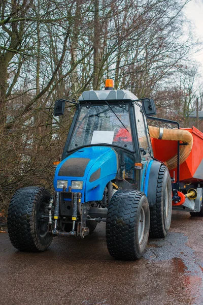 Blue tractor on the street. — Stock Photo, Image