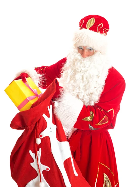 Santa with bag of presents. Isolated on white. — Stock Photo, Image