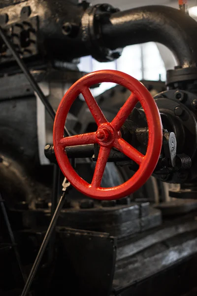 Red valve. Part of old power plant. — Stock Photo, Image