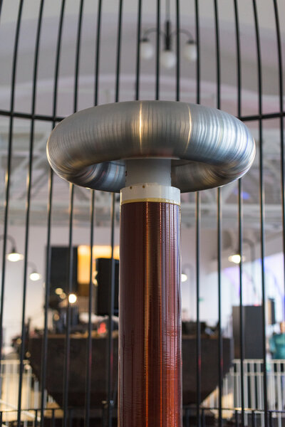 Resonant transformer in faraday cage. Tesla coil.