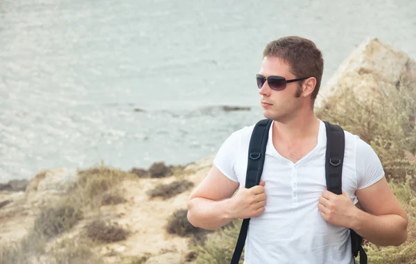 Portrait of male tourist with backpack. — Stock Photo, Image