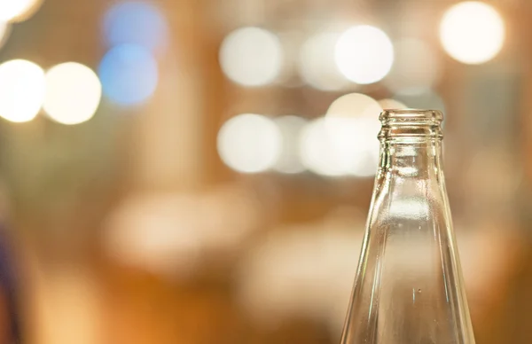 Neck of a glass bottle over bokeh. — Stock Photo, Image