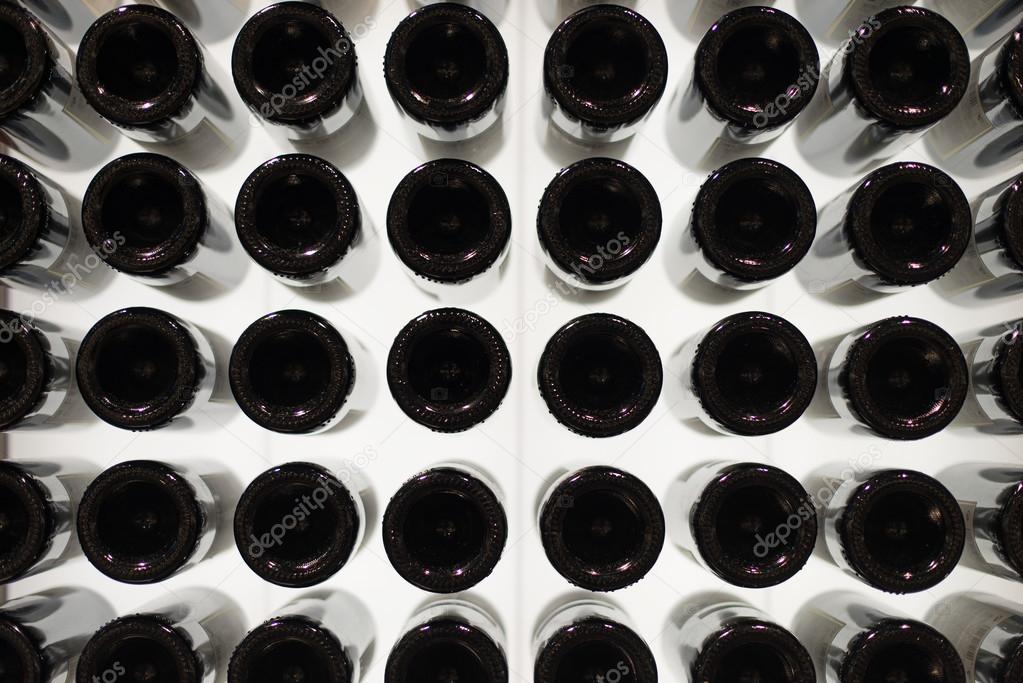 Many wine bottles. Bottom view.