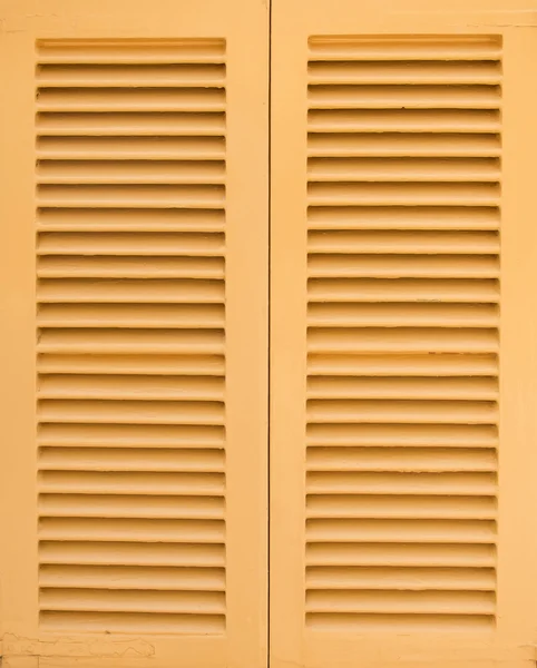 Window with beige shutters. Close-up view. — Stock Photo, Image
