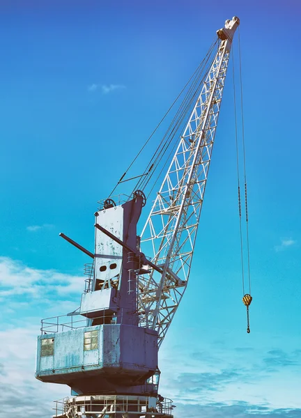 Harbor crane on rails over blue sky. — Stock Photo, Image