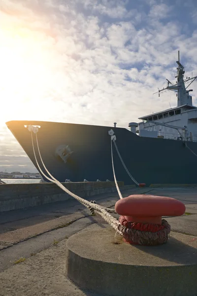 Naval auxiliary ship docked at the harbor. — Stock Photo, Image