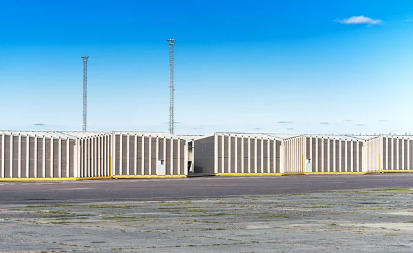 Outdoor view of many warehouses over blue sky. — Stock Photo, Image