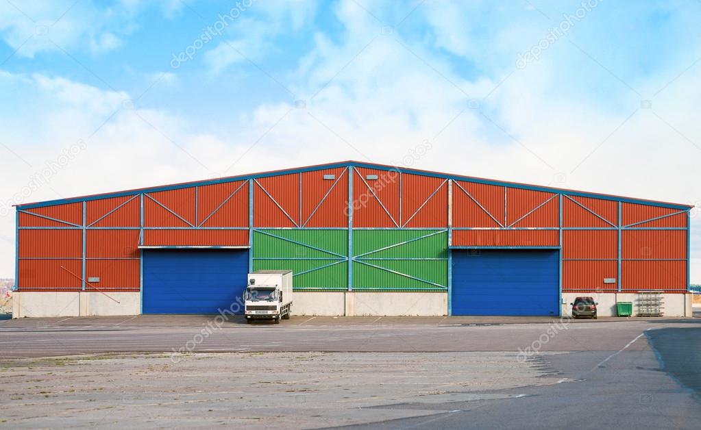 Large warehouse with two sliding gates.