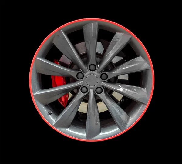 Sports car rim isolated on black background. — Stock Photo, Image